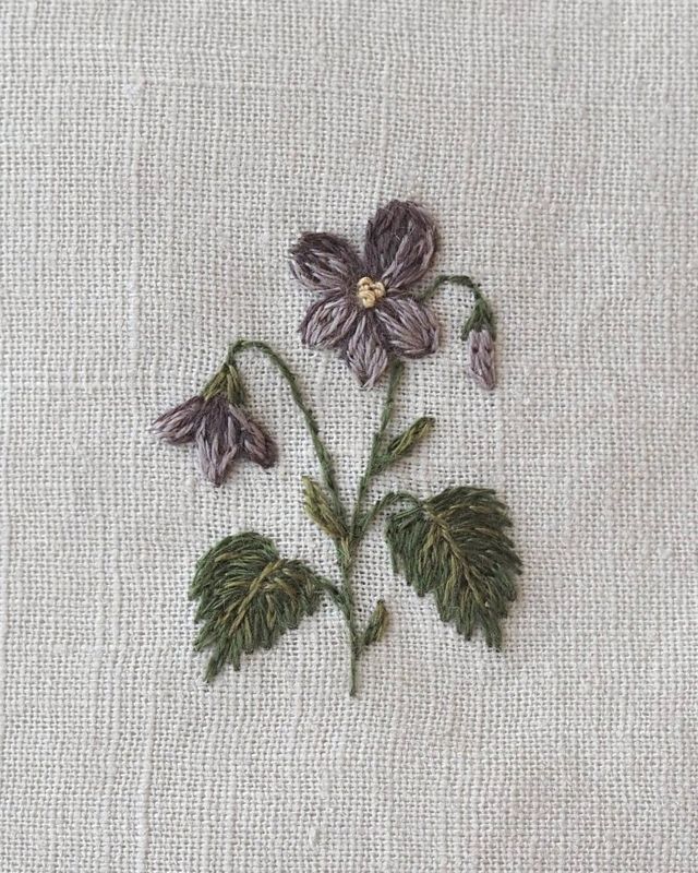 Embroidered violet in a hoop